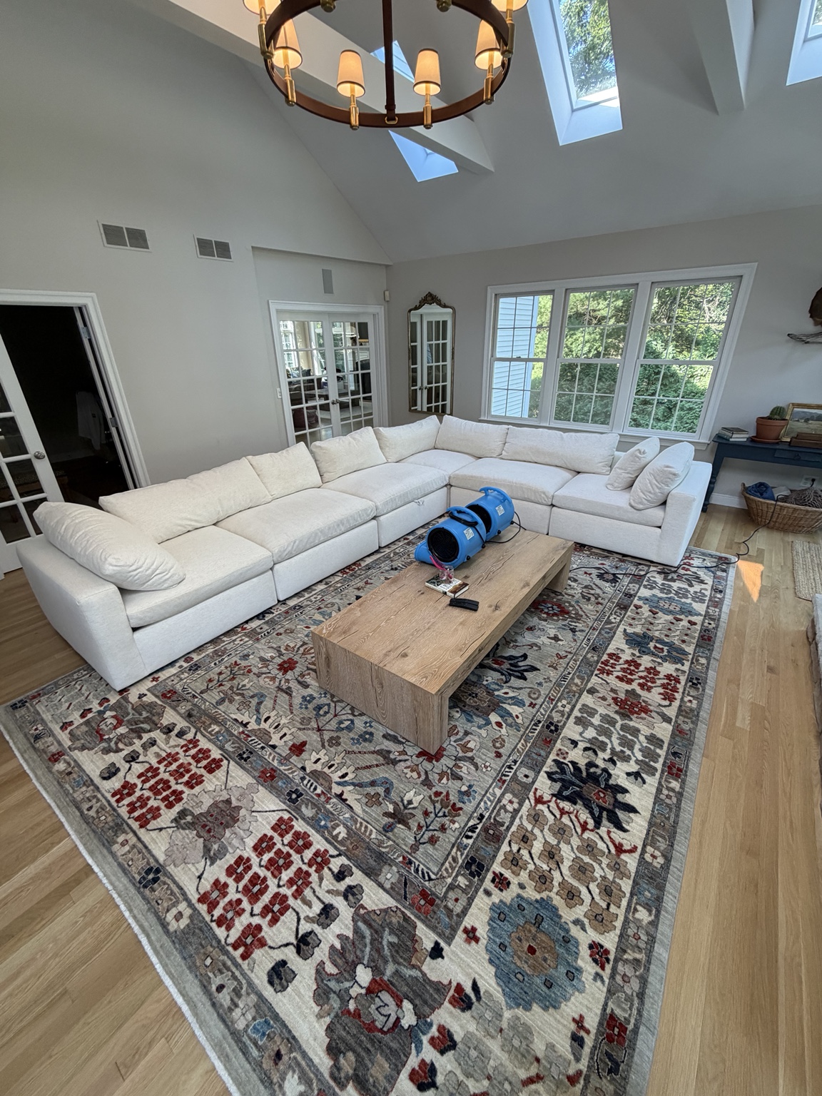 Professional couch cleaning on a white sectional in Massachusetts